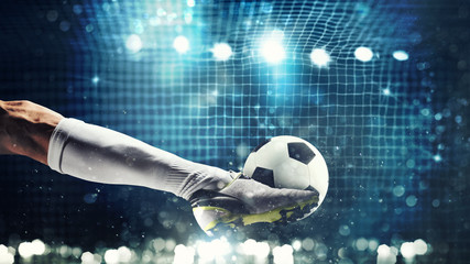 Fototapeta Close up of a soccer striker ready to kicks the ball in the football goal obraz