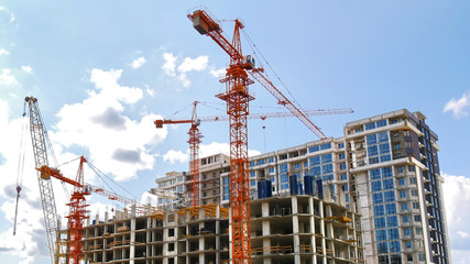 Construction cranes near building. Construction site.