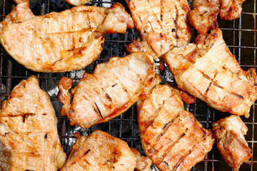 Grilled pork, Barbecue, Grilled BBQ meat food on fireplace grill, Meat meal background cut into grilled pieces top view