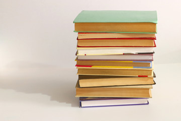 a stack of old books on a white background