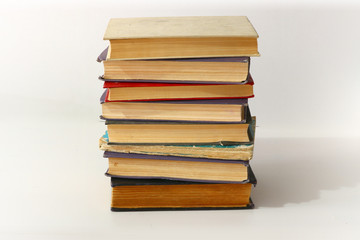 a stack of old books on a white background