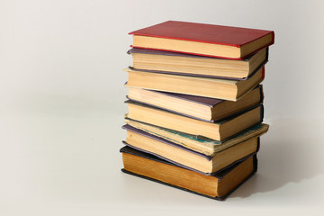 a stack of old books on a white background