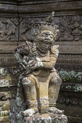 Traditional stone sculpture in temple. Ubud, island Bali, Indonesia.