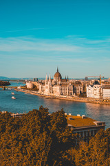 high formated picture of parliament at budapest with danube river and copy space in the sky