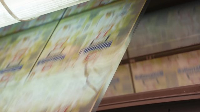 Printing press working at high speed in a large printing facility