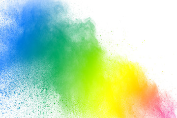 Abstract multi color powder explosion on white background.  Freeze motion of  dust  particles splashing. Painted Holi in festival