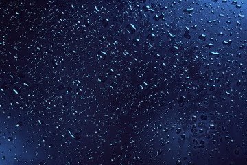 A waterdrops on blue surface, background