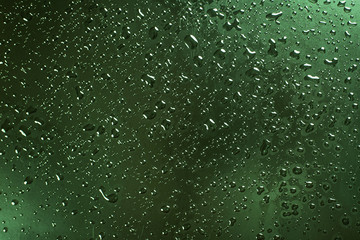 A waterdrops on green surface, background