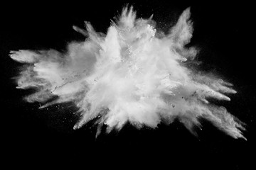 Launched white powder splash on black background.Stopping the movement of white powder on dark background.