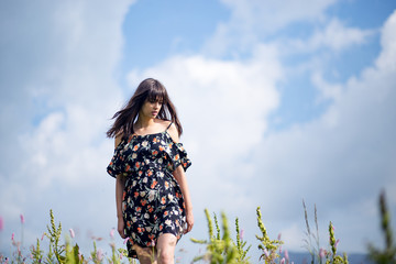 Portrait of beautiful girl posing in mountain field.Beauty girl outdoors enjoying nature