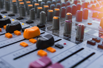 buttons equipment in audio recording outdoor studio of the orange sun flare colour