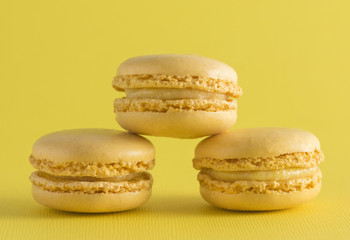 Yellow French Macarons on a Yellow Background