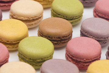 Fototapeta na wymiar A Variety of French Macarons Flavors on a White Background