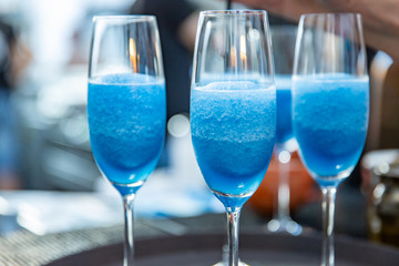 Martini. Alcohol drinks and cocktails on bar. colored light