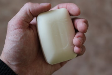 Piece of soap in hand