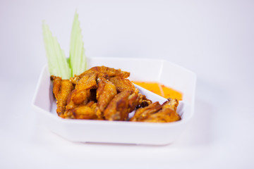 Chicken fired on white dish with white background