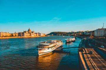 Naklejka premium beautiful danube river at budapest with high way on the side - without any logos on the cars