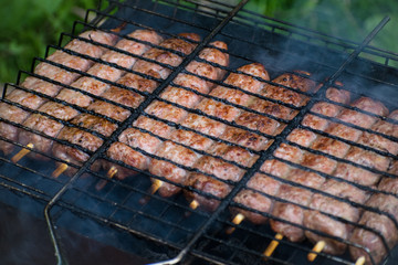 Lulya kebab from meat are prepared in the grill. Shish kebab in the grill.
