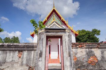 Fototapeta premium Thai stye temple in front of old wooden door.