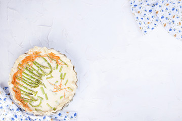 pie with asparagus and cheese, useful pastries with vegetables. White background. copy space, flat lay