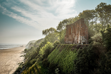 ruins of an old church by the sea on a cliff