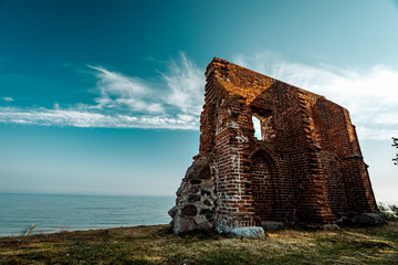 ruins of an old church by the sea on a cliff