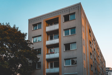 Fototapeta premium typical block formed apartment building with square balcony in vintage colors