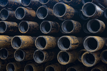 Oil Drill pipe. Rusty drill pipes were drilled in the well section. Downhole drilling rig. Laying...