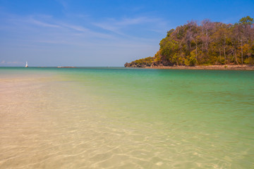 White sand beach with moutain under clear sky at ocean in Tropicana located at south of Thailand 