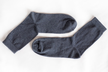 A pair of men's socks on a white background. Manufacture and sale of socks_