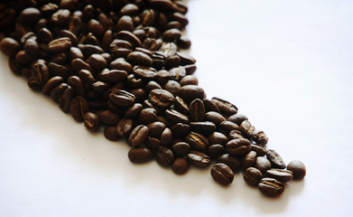 Beautiful background with scattered coffee beans