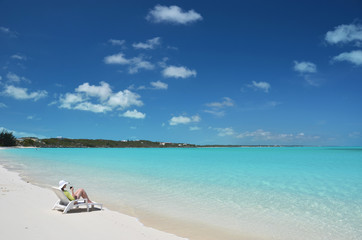 Fototapeta na wymiar Girl on the beach. Great Exuma, Bahamas