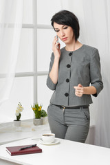 portrait of a business woman in a white interior