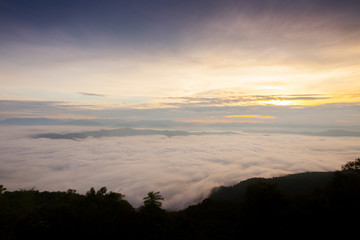 Fototapeta na wymiar A cloudy of foggy landscape view on top view of mountain at sunrise timing in winter season located north of thailand 