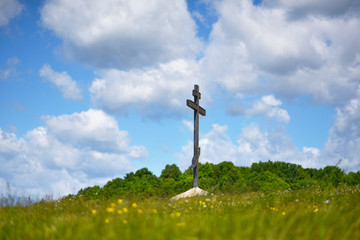 Orthodox cross against the blue sky