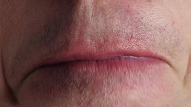 Man chewing gum. Closeup