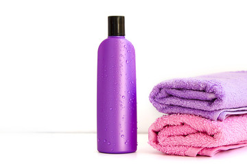 two cosmetic bottles on isolated background