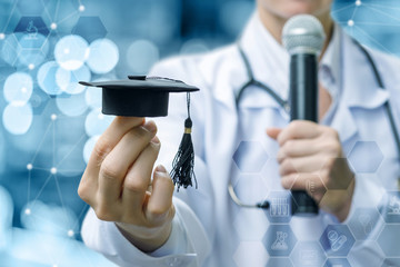 Doctor shows academic cap .