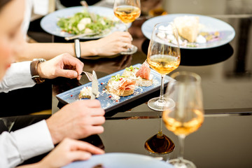 Close-up view on the delicious meals and wine during a business lunch at the restaurant