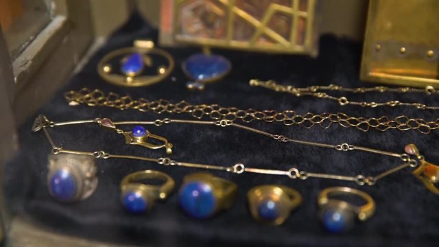 A close up shot of rings with blue stones.