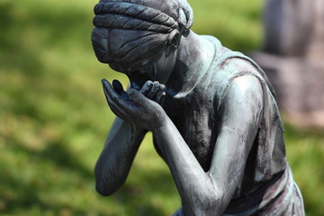 Sculpture of a grieving mother on an old tomb of the cemetery of Montreal-Canada