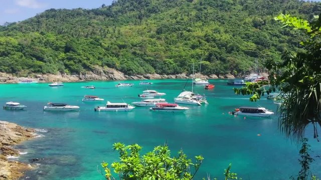 View from viewpoint at Tropical Racha Island. Сrystal clear water, rocks and boats near Phuket, Thailand