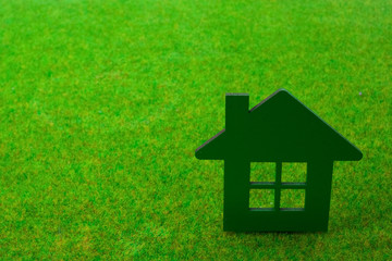 House on green grass background