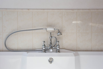 Old fashion faucet over jacuzzi bath tub vintage design