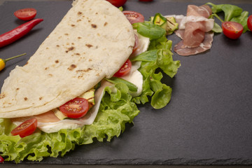 Piadina romagnola with cheese and ham