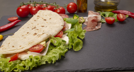 Piadina romagnola with cheese and ham