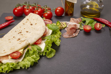 Piadina romagnola with cheese and ham