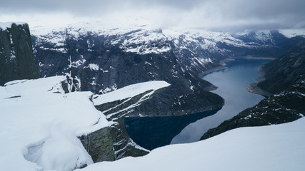 Trolltunga under snow, winter landscape of Troll Tongue, rock formation at the Hardangerfjord near...