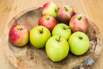 Juicy apples on wooden table