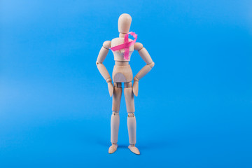 breast cancer awareness pink ribbon on joined wood figure